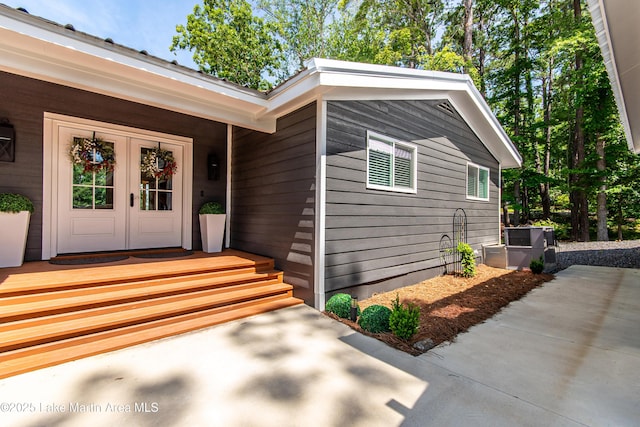 view of exterior entry featuring french doors