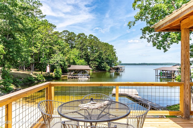 deck with a water view and a boat dock