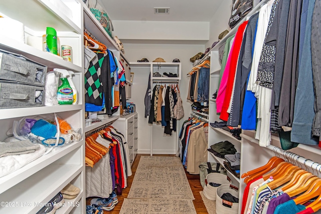 walk in closet featuring dark hardwood / wood-style floors