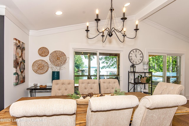 living room featuring wood-type flooring, a wealth of natural light, a chandelier, and vaulted ceiling with beams