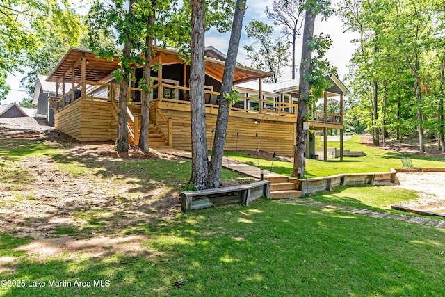 view of play area with a yard and a deck