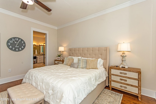 bedroom featuring crown molding, ensuite bathroom, and dark hardwood / wood-style flooring