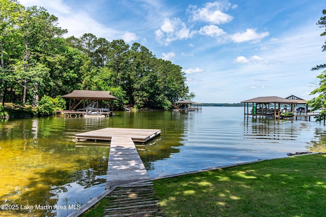 dock area with a gazebo and a water view