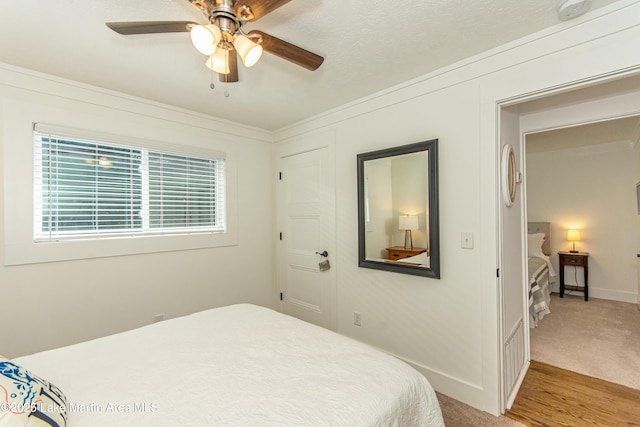 bedroom featuring ceiling fan and carpet floors