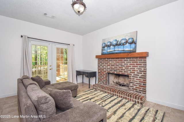 93 Restful Cv, Dadeville, AL 36853 - living room with french doors, a brick fireplace, and a textured ceiling