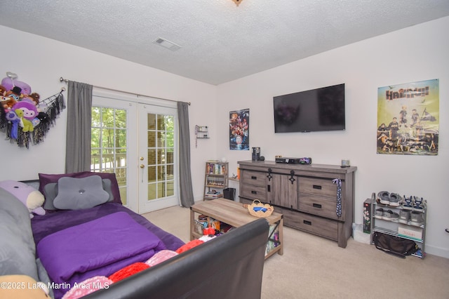 93 Restful Cv, Dadeville, AL 36853 - bedroom featuring access to outside, light colored carpet, french doors, and a textured ceiling