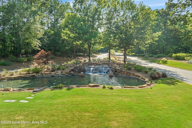 93 Restful Cv, Dadeville, AL 36853 - view of grassy yard featuring a small pond