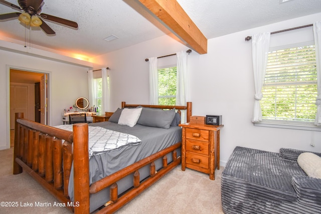 93 Restful Cv, Dadeville, AL 36853 - bedroom with light colored carpet, beam ceiling, a textured ceiling, and ceiling fan