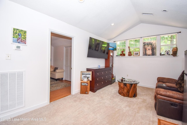 93 Restful Cv, Dadeville, AL 36853 - sitting room with carpet and vaulted ceiling
