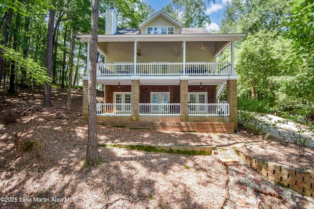 93 Restful Cv, Dadeville, AL 36853 - view of front of property featuring french doors, a chimney, and covered porch