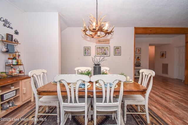 93 Restful Cv, Dadeville, AL 36853 - dining room featuring a chandelier and wood finished floors