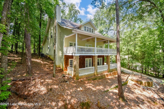 93 Restful Cv, Dadeville, AL 36853 - view of front facade featuring a chimney and a porch