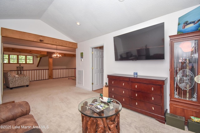 93 Restful Cv, Dadeville, AL 36853 - carpeted living room with vaulted ceiling and a chandelier