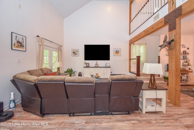 93 Restful Cv, Dadeville, AL 36853 - living area featuring high vaulted ceiling and wood finished floors