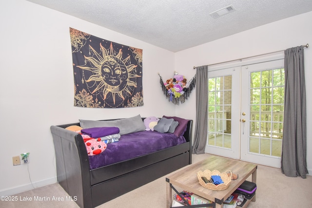 93 Restful Cv, Dadeville, AL 36853 - carpeted bedroom featuring french doors, access to outside, and a textured ceiling