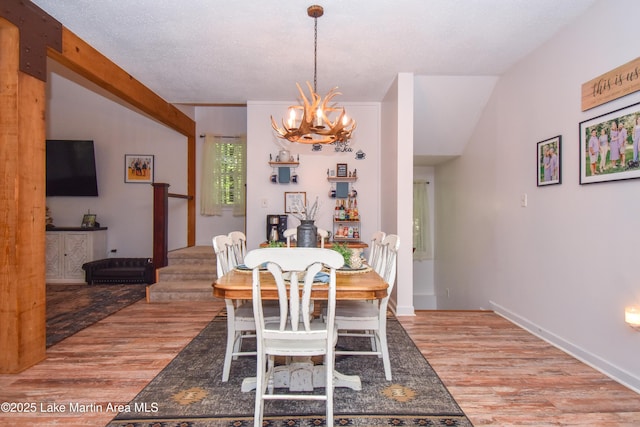93 Restful Cv, Dadeville, AL 36853 - dining space with a chandelier and light wood-style flooring