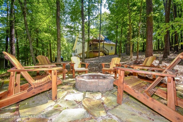 93 Restful Cv, Dadeville, AL 36853 - view of patio / terrace with an outdoor fire pit