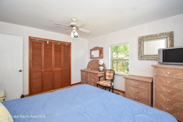 bedroom featuring ceiling fan and a closet