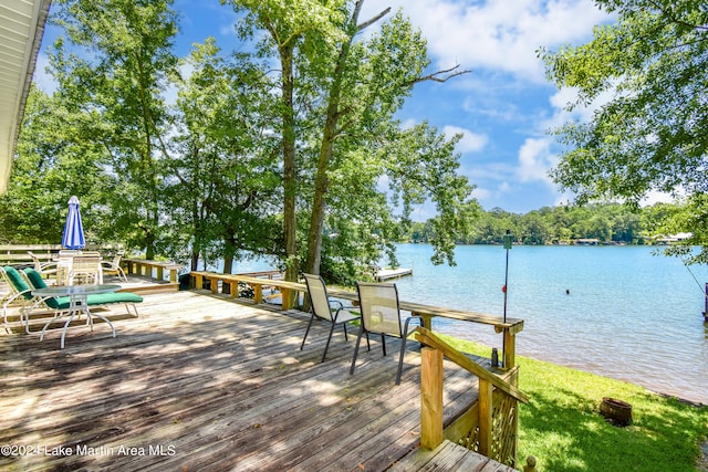 dock area featuring a deck with water view