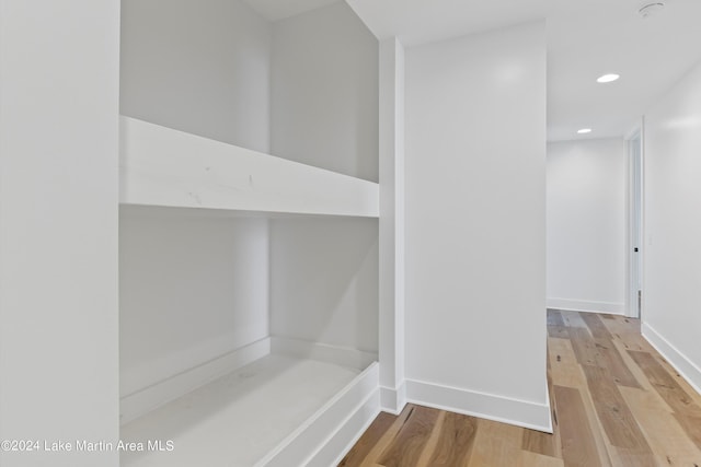 bathroom with hardwood / wood-style flooring