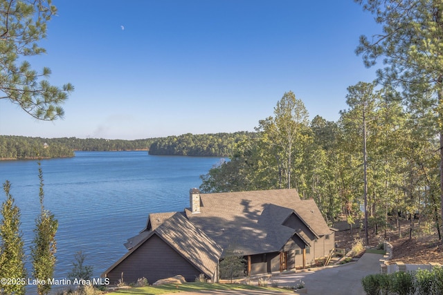 property view of water featuring a wooded view