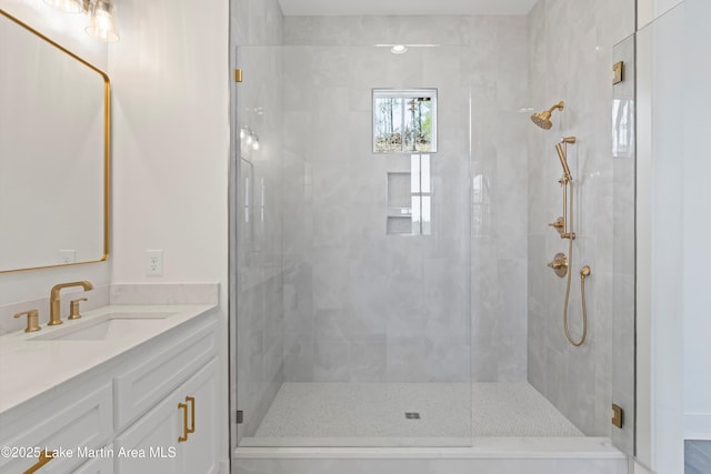 full bathroom featuring a shower stall and vanity