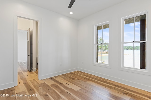 unfurnished room with recessed lighting, light wood-type flooring, baseboards, and ceiling fan