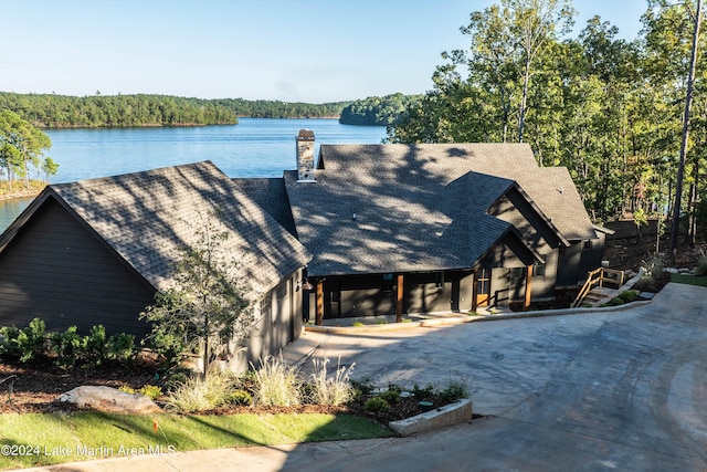 view of front facade with a patio and a water view