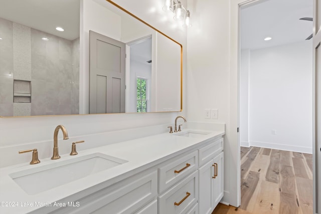 bathroom with vanity and hardwood / wood-style flooring