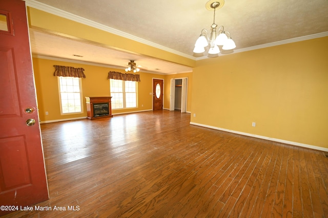 unfurnished living room with a textured ceiling, crown molding, wood-type flooring, and ceiling fan with notable chandelier