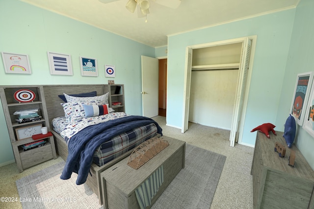 bedroom featuring light carpet, a closet, and ceiling fan