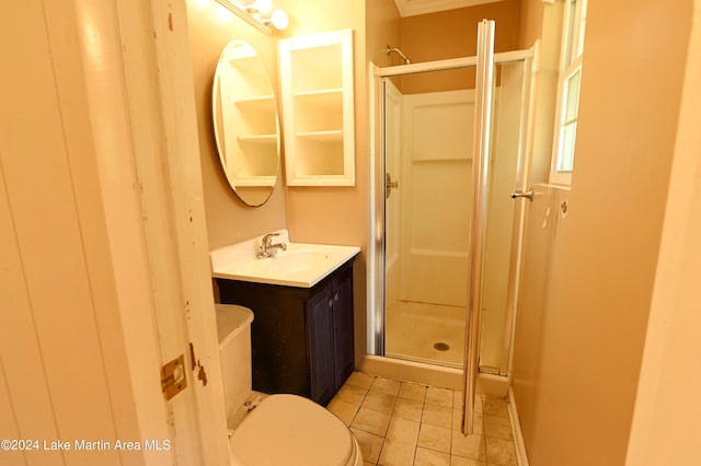 bathroom with vanity, toilet, tile patterned flooring, and walk in shower