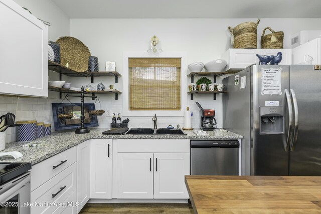 441 Cove Dr, Eclectic, AL 36024 - kitchen with wooden counters, a sink, open shelves, and appliances with stainless steel finishes