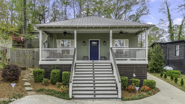 441 Cove Dr, Eclectic, AL 36024 - view of front of house with stairs, metal roof, and covered porch