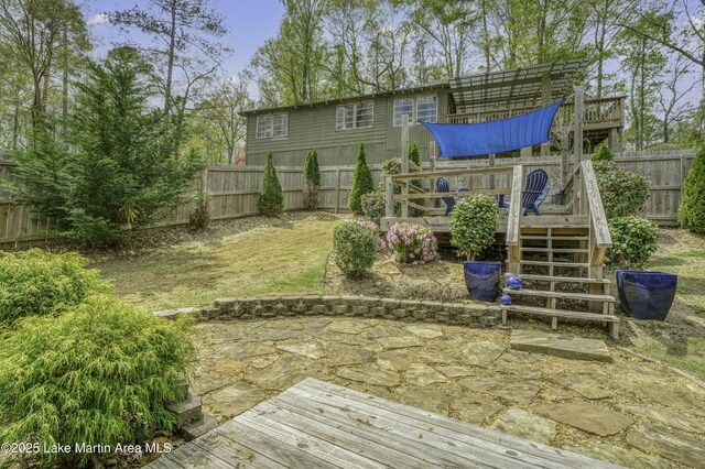441 Cove Dr, Eclectic, AL 36024 - view of yard with a fenced backyard, a wooden deck, a patio, and stairway