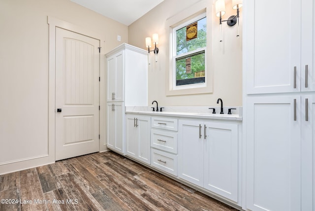 bathroom with wood-type flooring and vanity