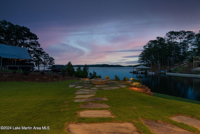 yard at dusk with a water view