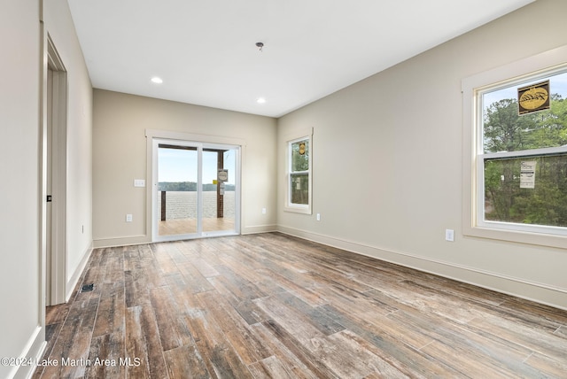 spare room with light hardwood / wood-style floors