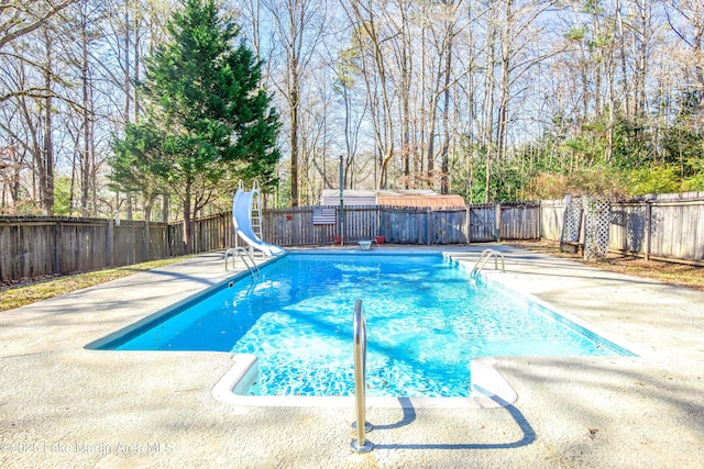 view of swimming pool featuring a water slide