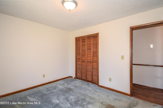 unfurnished bedroom with carpet and a closet