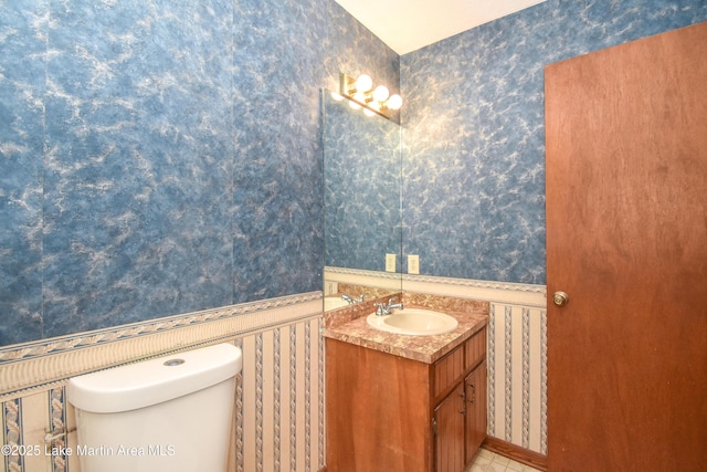 bathroom with vanity and toilet