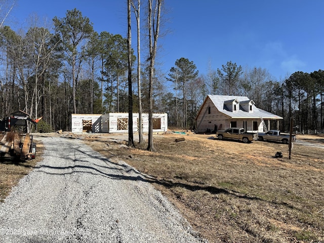 view of road featuring gravel driveway