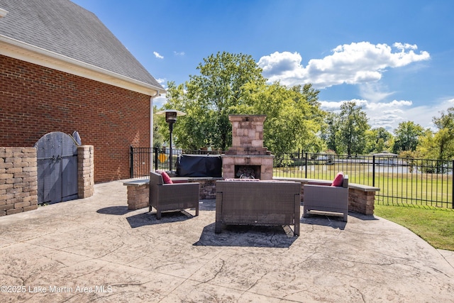 view of patio / terrace featuring an outdoor living space with a fireplace and fence