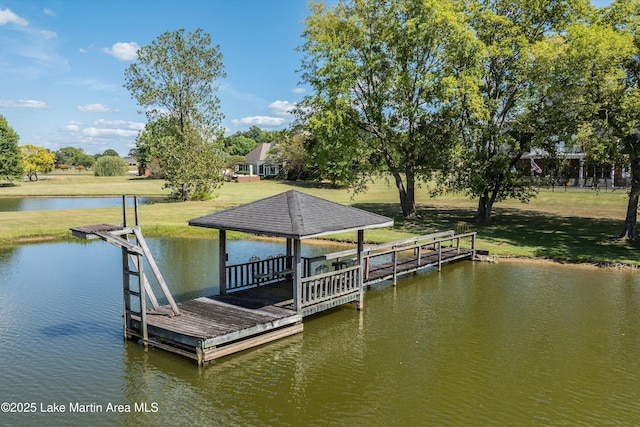 dock area featuring a yard and a water view