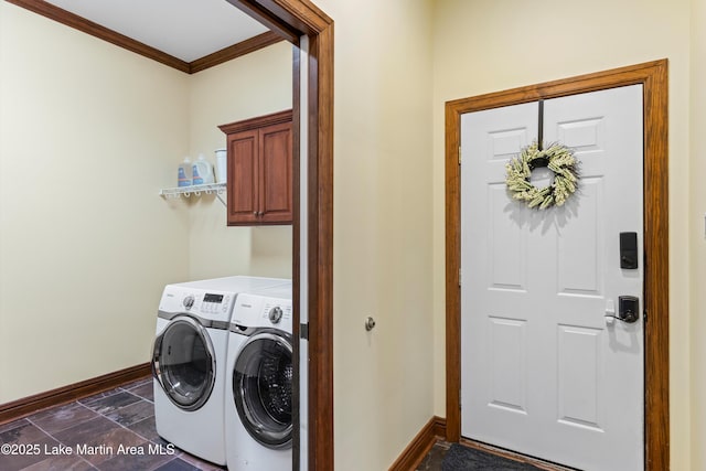 laundry room featuring cabinet space, baseboards, washer and clothes dryer, ornamental molding, and stone finish flooring