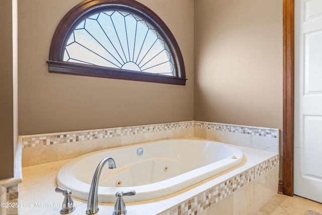 full bath featuring a jetted tub and tile patterned floors