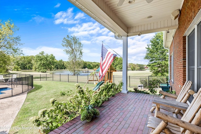 view of patio with a fenced backyard and a playground