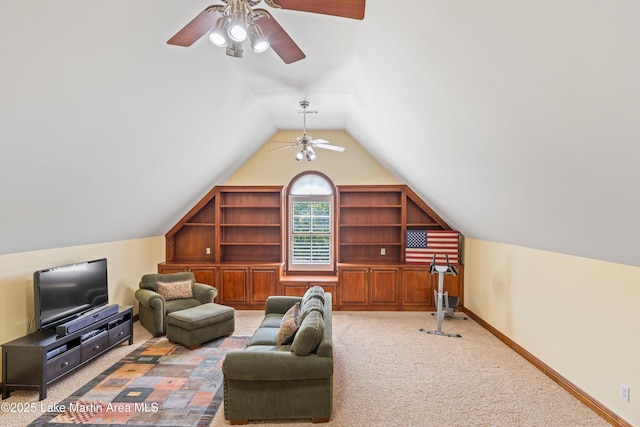 living area featuring carpet floors, ceiling fan, baseboards, and lofted ceiling