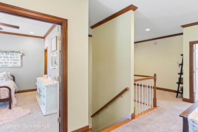 hall featuring recessed lighting, carpet flooring, an upstairs landing, baseboards, and crown molding