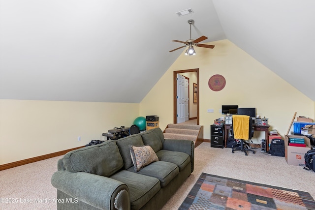 home office featuring lofted ceiling, carpet, visible vents, and baseboards